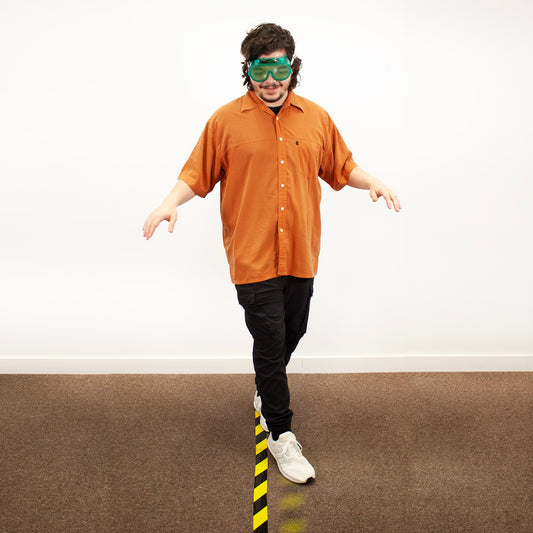 Person wearing Marijuana/Cannabis Perception Deception Goggles for health education trying to walk a line, Health Edco, 77864