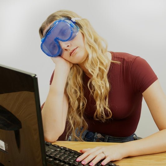 Person wearing Sleep Deprivation Perception Deception Goggles in front of computer, Health Edco simulation goggles, 77866