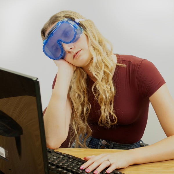 Person wearing Sleep Deprivation Perception Deception Goggles in front of computer, Health Edco simulation goggles, 77866