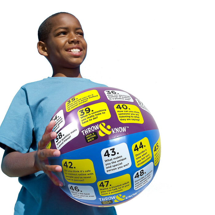 Boy holding Social & Emotional Health Throw & Know Activity Ball, inflatable health education ball , Health Edco, 78008