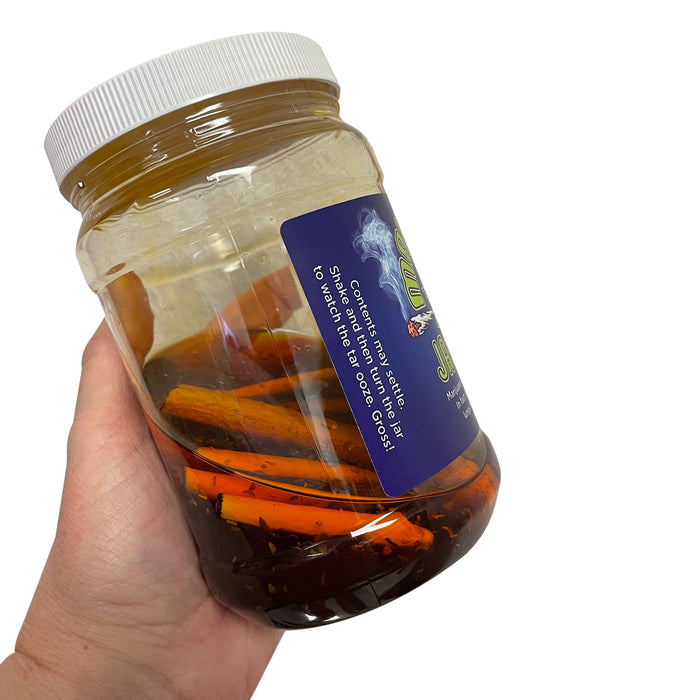 Marijuana Jar of Tar, health teaching tool, simulated marijuana tar held in hand with joint facsimiles, Health Edco, 78846