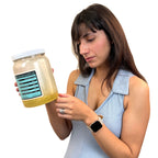 Young women reading label on Health Edco's Vat of Fat, a health education jar representing extra calories, Health Edco 79129