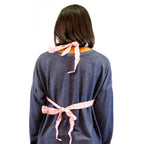 MOM (Mother's Own Milk) Breastfeeding Trainer, Brown, worn by a student as shown tied in the back, Childbirth Graphics, 79832